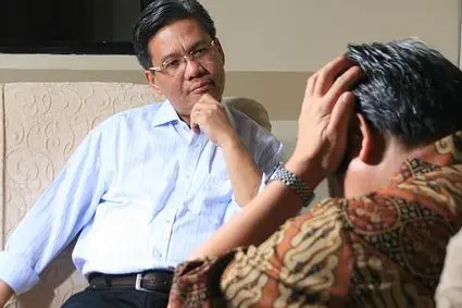 Counsellor listening to patient